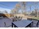 Backyard area featuring brick patio, outdoor furniture, and a wooden fence at 4260 Newland St, Wheat Ridge, CO 80033