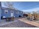 Backyard patio area featuring a table and chairs, lounge seating and a fire pit at 4260 Newland St, Wheat Ridge, CO 80033
