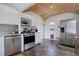 Well-equipped kitchen with wood ceiling, stainless steel appliances, and slate floors at 4260 Newland St, Wheat Ridge, CO 80033