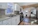 Clean, bright kitchen featuring stainless steel appliances and a slate floor at 4260 Newland St, Wheat Ridge, CO 80033