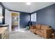 Inviting living room with a comfortable sofa, natural light, and stylish decor at 4260 Newland St, Wheat Ridge, CO 80033