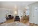 Charming living room featuring hardwood floors, large windows, and modern decor at 4260 Newland St, Wheat Ridge, CO 80033