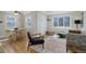 Inviting living room boasts ample natural light, hardwood floors, and ceiling fan at 4260 Newland St, Wheat Ridge, CO 80033