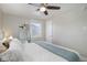Bright bedroom featuring ample natural light, ceiling fan, and closet at 4260 Newland St, Wheat Ridge, CO 80033