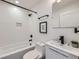 Clean bathroom features modern tiling, a shower-tub combination, and black matte plumbing fixtures at 3829 Osage St, Denver, CO 80211