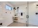 Modern bathroom featuring white tiling, shower, and sink vanity with contemporary fixtures at 3829 Osage St, Denver, CO 80211