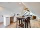 Bonus room featuring a kitchenette, bar top dining, and additional seating area at 3829 Osage St, Denver, CO 80211