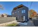 Modern home exterior featuring sleek lines, a private backyard patio, and contemporary design elements at 3829 Osage St, Denver, CO 80211