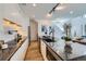 Modern kitchen featuring a large island with seating, sleek cabinetry, and stainless-steel appliances at 3829 Osage St, Denver, CO 80211