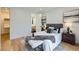 Bright main bedroom features white walls, wood floors, and an attached walk-in closet at 3829 Osage St, Denver, CO 80211