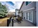 A back deck area with outdoor dining furniture and a sliding glass door to enter the home at 11335 Haswell Dr, Parker, CO 80134