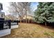 Spacious backyard featuring a patio, lush trees, and a well-maintained fence offering privacy at 11335 Haswell Dr, Parker, CO 80134