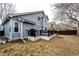 Beautiful backyard featuring a deck, lush grass, and charming landscaping at 11335 Haswell Dr, Parker, CO 80134