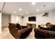 Inviting basement featuring comfortable seating and a mounted TV at 11335 Haswell Dr, Parker, CO 80134