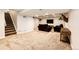 Spacious basement with carpeted floors, a mounted TV, and comfortable seating at 11335 Haswell Dr, Parker, CO 80134