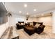 Finished basement featuring neutral walls, carpet, a mounted television, and two couches at 11335 Haswell Dr, Parker, CO 80134