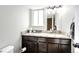 Bathroom featuring a granite countertop, undermount sink, and ample storage at 11335 Haswell Dr, Parker, CO 80134