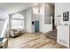 Welcoming entryway features a soaring ceiling, hardwood floors, and staircase leading to the upper level at 11335 Haswell Dr, Parker, CO 80134