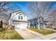 View of the home's front exterior featuring the garage, landscaping, and architectural details at 11335 Haswell Dr, Parker, CO 80134
