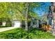 Charming home with well-manicured lawn, mature trees, and a two-car garage nestled on a quiet street at 11335 Haswell Dr, Parker, CO 80134