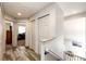Upstairs hallway features wood floors and neutral walls at 11335 Haswell Dr, Parker, CO 80134