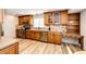 Spacious kitchen with stainless steel appliances, granite countertops, wood cabinets, and breakfast bar at 11335 Haswell Dr, Parker, CO 80134