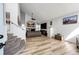 Spacious living room with a fireplace, vaulted ceilings, and modern flooring at 11335 Haswell Dr, Parker, CO 80134