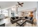 Open-concept living space with a view of the entryway, dining area, and modern furnishings at 11335 Haswell Dr, Parker, CO 80134