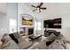 Cozy living room with vaulted ceilings, a stone fireplace, and comfortable seating area perfect for relaxation at 11335 Haswell Dr, Parker, CO 80134