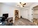 Office space with desk, bookcase, ceiling fan, and neutral gray carpet at 11335 Haswell Dr, Parker, CO 80134