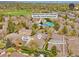 Aerial view showcasing the community amenities, including the pool, tennis courts, and nearby parking at 5872 W Asbury Pl, Lakewood, CO 80227