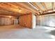 Unfinished basement with exposed ceiling, concrete floor, and framed area for future customization at 5872 W Asbury Pl, Lakewood, CO 80227