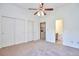 Spacious bedroom with multiple closets and easy access to the in-unit laundry and bathroom at 5872 W Asbury Pl, Lakewood, CO 80227