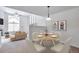Inviting dining area with seating for four, open to a comfortable living space at 5872 W Asbury Pl, Lakewood, CO 80227
