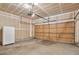 A clean and spacious two car garage with an automatic door opener and plenty of room for storage at 5872 W Asbury Pl, Lakewood, CO 80227