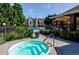Community hot tub and pool, with nearby clubhouse and well-maintained landscaping at 5872 W Asbury Pl, Lakewood, CO 80227