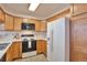 Well-equipped kitchen boasting ample cabinet space and modern amenities at 5872 W Asbury Pl, Lakewood, CO 80227