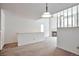 Spacious living area with a cozy fireplace and ample natural light at 5872 W Asbury Pl, Lakewood, CO 80227