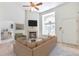 Open-concept living area featuring a fireplace, large window, and comfortable seating arrangement at 5872 W Asbury Pl, Lakewood, CO 80227