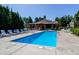 Community pool and clubhouse with plenty of lounge seating and lush landscaping at 5872 W Asbury Pl, Lakewood, CO 80227