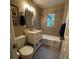 Charming full bathroom offers a tub and shower, and vanity with marble countertop at 1364 Iola St, Aurora, CO 80010