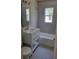 Bright bathroom featuring a tub-shower combo, a large mirror, and a white vanity at 1364 Iola St, Aurora, CO 80010