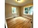 This bedroom has hardwood floors and dual windows providing plenty of natural light at 1364 Iola St, Aurora, CO 80010