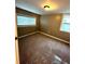 An inviting bedroom featuring neutral walls, carpet, and windows allowing natural light at 1364 Iola St, Aurora, CO 80010