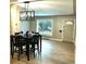 Cozy dining area with a modern chandelier, window views, and an inviting atmosphere at 1364 Iola St, Aurora, CO 80010