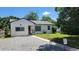 Charming single-story home with neutral siding, well-maintained lawn and updated landscaping at 1364 Iola St, Aurora, CO 80010