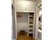 Hallway closet features convenient built-in storage shelves and hanging space at 1364 Iola St, Aurora, CO 80010