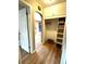 Hallway with closet providing convenient storage with basket shelves at 1364 Iola St, Aurora, CO 80010