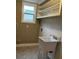 The laundry room features shelving and a utility sink at 1364 Iola St, Aurora, CO 80010