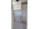 A bright laundry room featuring built-in shelves and a utility sink at 1364 Iola St, Aurora, CO 80010